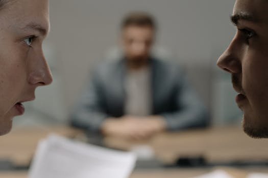 Close-up of two men in a serious discussion at a business meeting. sindico