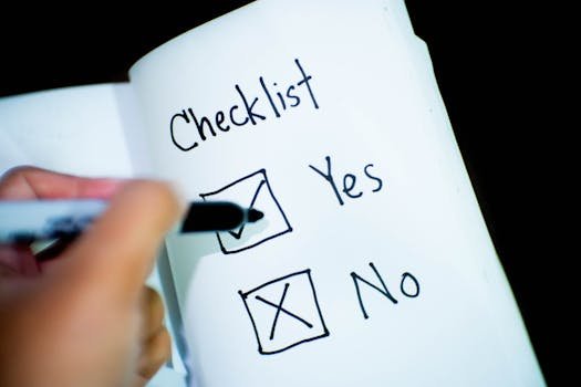 A notebook featuring a checklist with a marked 'Yes' box, captured in a close-up shot. airbnb