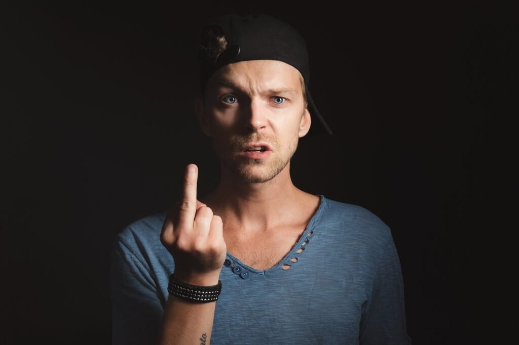 man, finger, funny, young, aggression, bully, you, harassment, frustration, naughty, adolescent, teenager, teen, boy, sign, symbol, arrogance, arrogant, confident, trouble, bad, behaviour, provoke, troublemaker