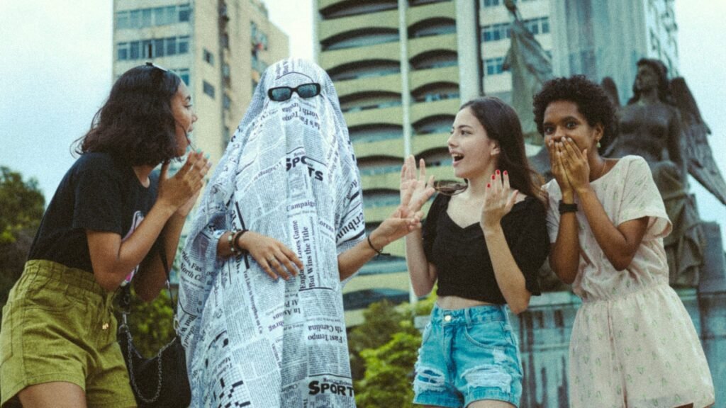 A playful group of friends with a ghost costume, enjoying a city day out.